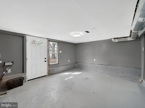 a view of a livingroom with an empty space and window