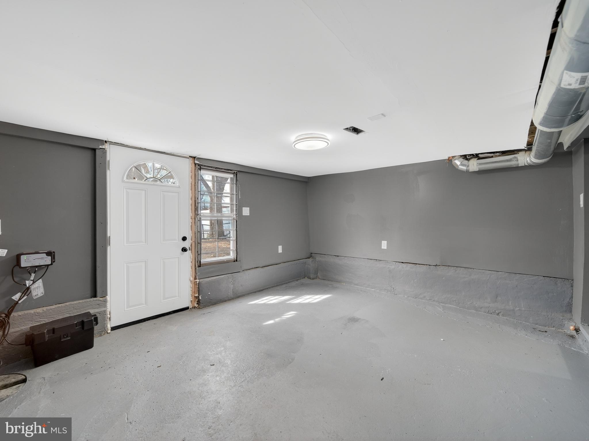 5919 Addison Road Capitol Heights, MD 20743 - Photo 35 of 40 a view of a livingroom with an empty space and window