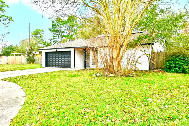 a view of yellow house with a yard