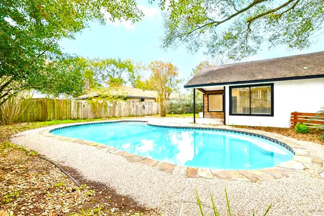 a view of swimming pool with a backyard