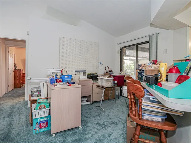 a room with furniture a rug toys and a baby crib