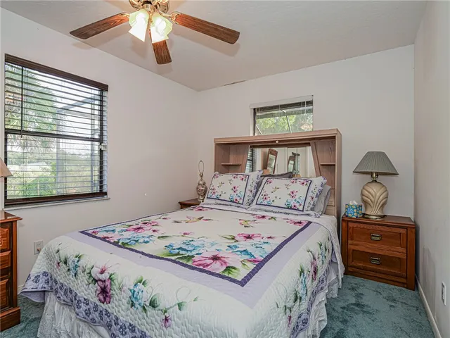 a bedroom with a bed and dresser