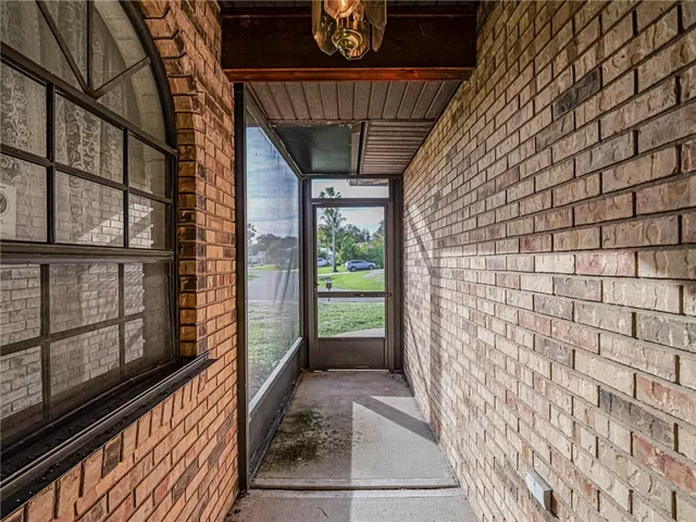 a view of a porch with wooden floor