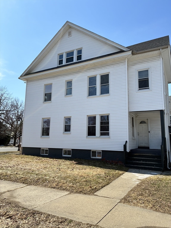 658 Sumner Avenue, Unit 2 Springfield, MA 01108 - Photo 2 of 11 a house view with a backyard
