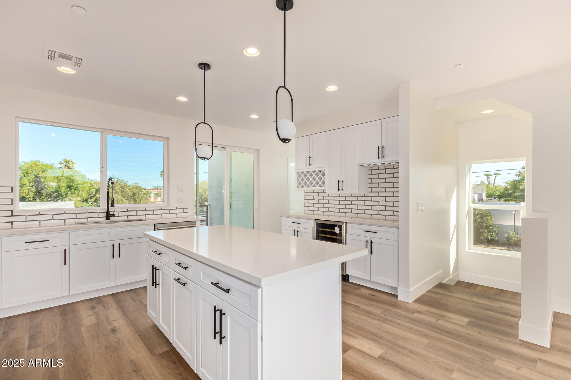 3616 North 12th Street Phoenix, AZ 85014 - Photo 15 of 25 a kitchen with white cabinets and white appliances