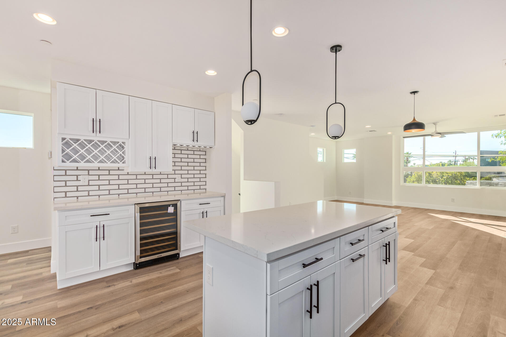 3616 North 12th Street Phoenix, AZ 85014 - Photo 16 of 25 a kitchen with stainless steel appliances granite countertop a sink a oven and a wooden floor