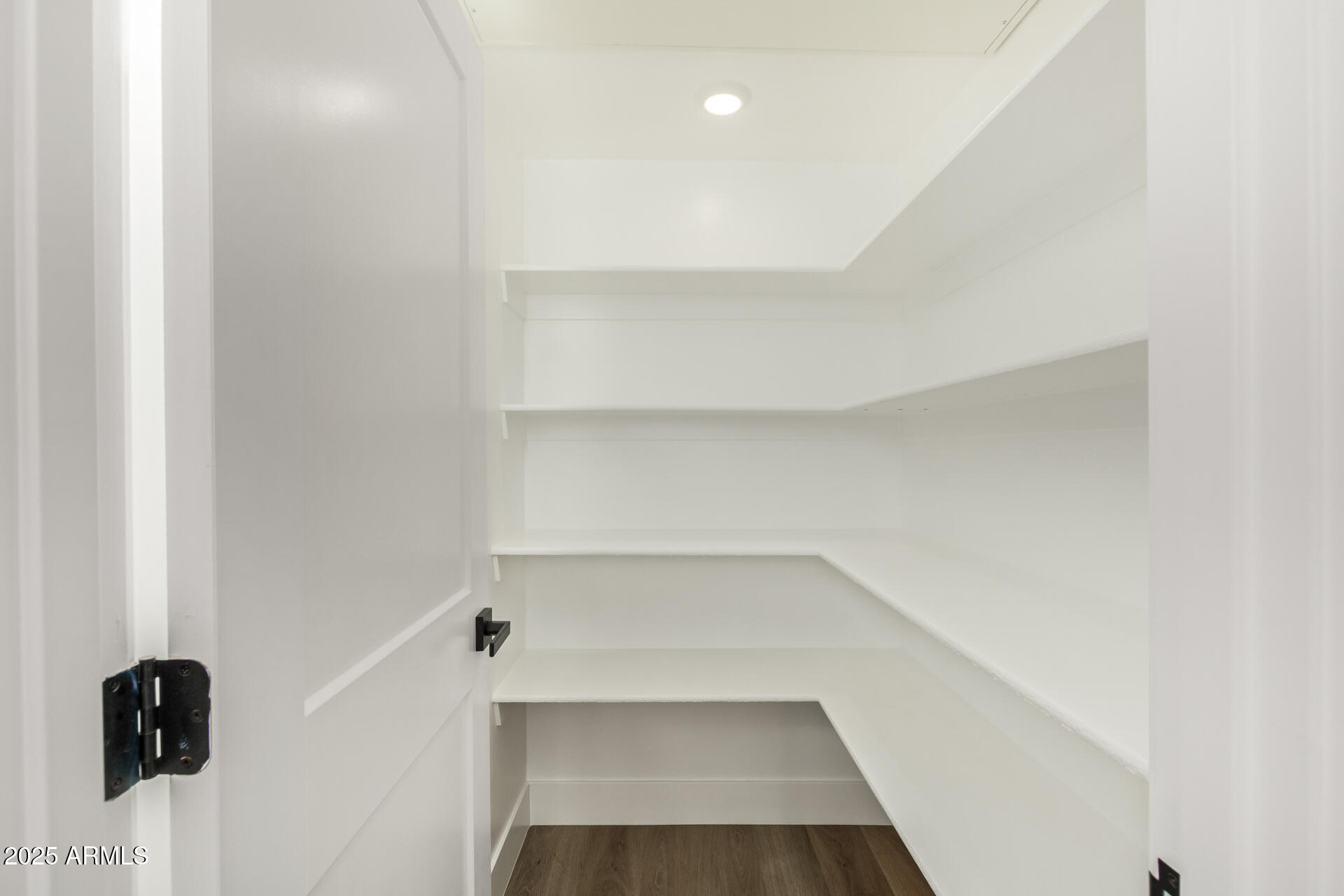 3616 North 12th Street Phoenix, AZ 85014 - Photo 18 of 25 a view of walk in closet with empty racks