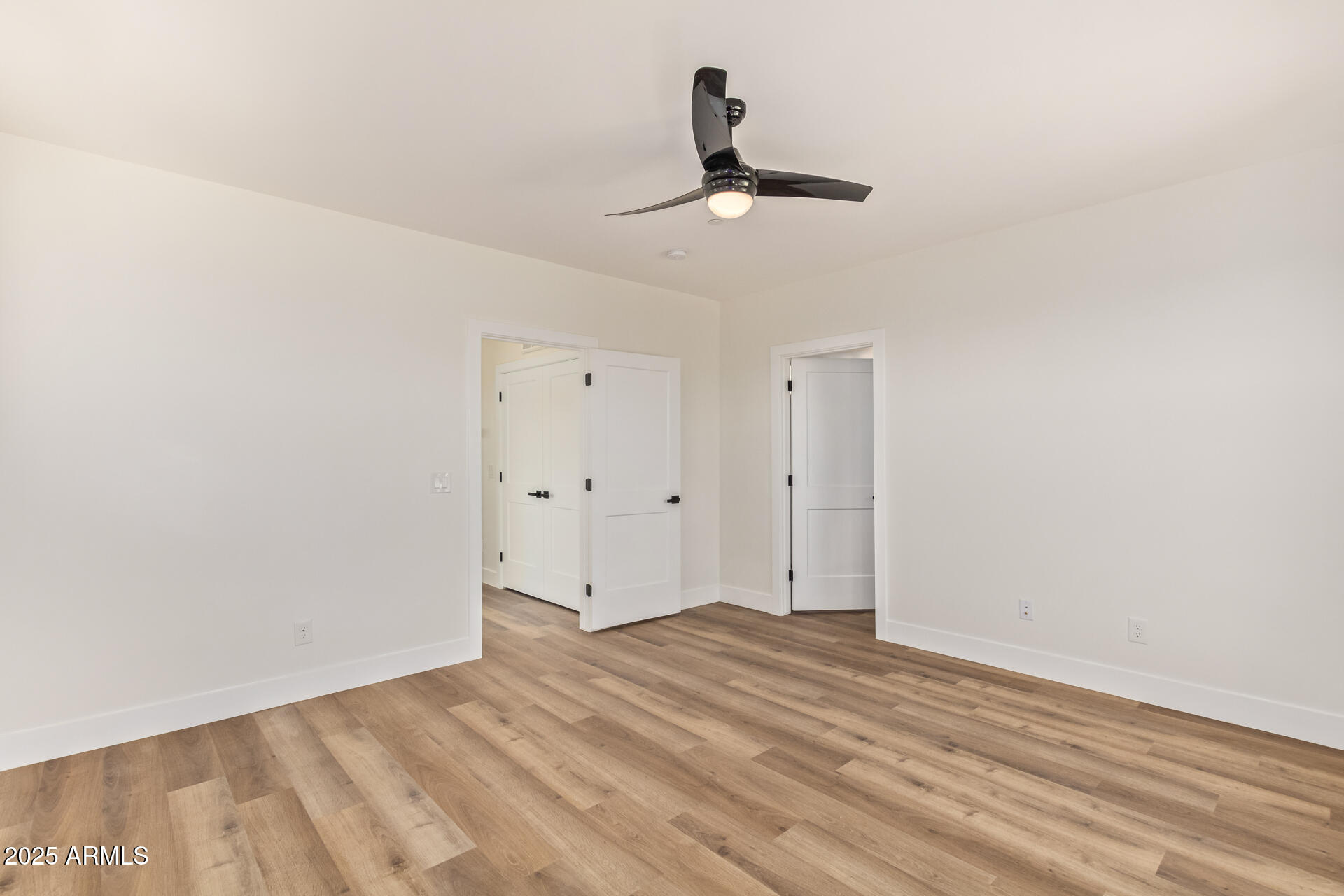 3616 North 12th Street Phoenix, AZ 85014 - Photo 21 of 25 a view of empty room with wooden floor