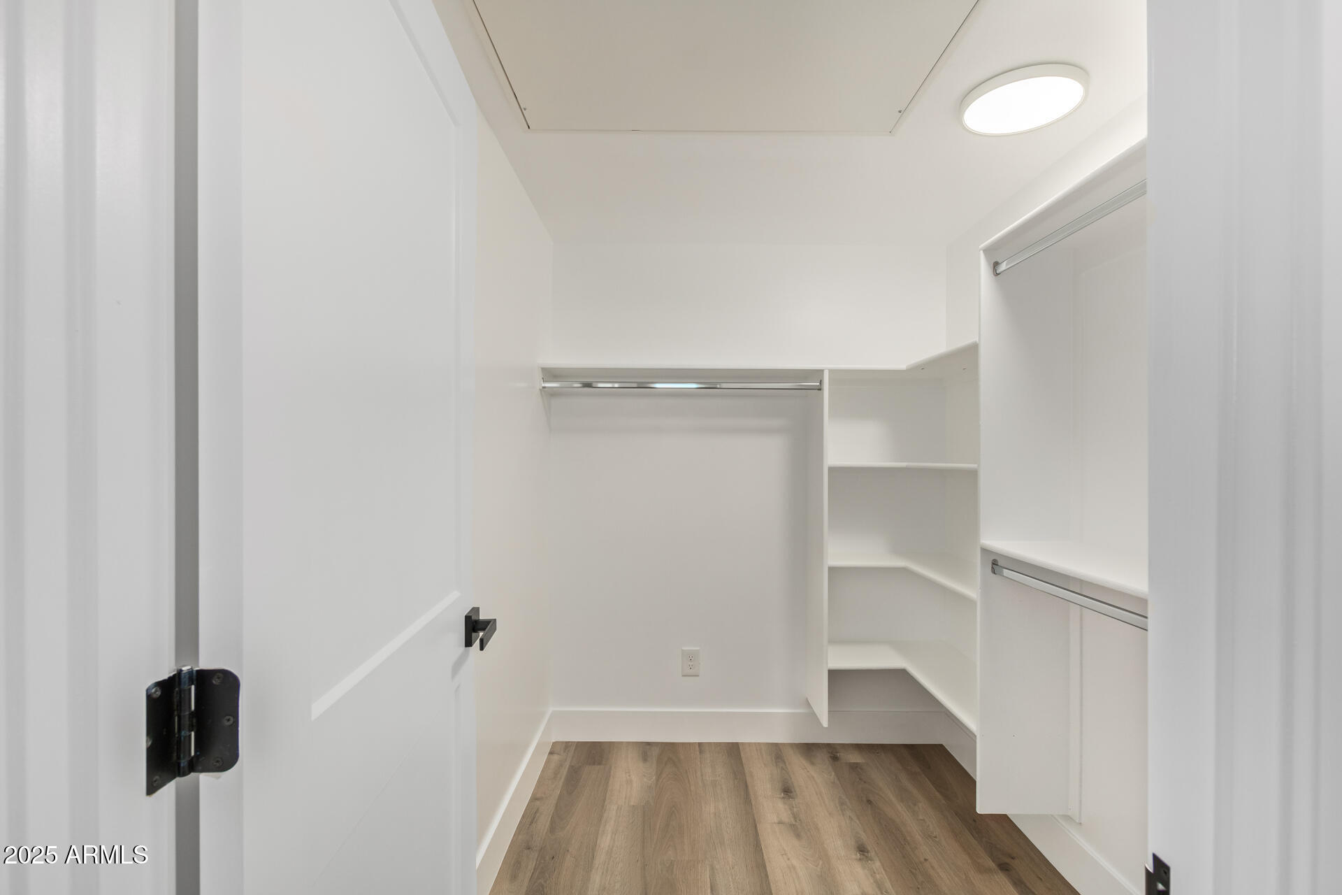 3616 North 12th Street Phoenix, AZ 85014 - Photo 24 of 25 a view of walk in closet with wooden floor