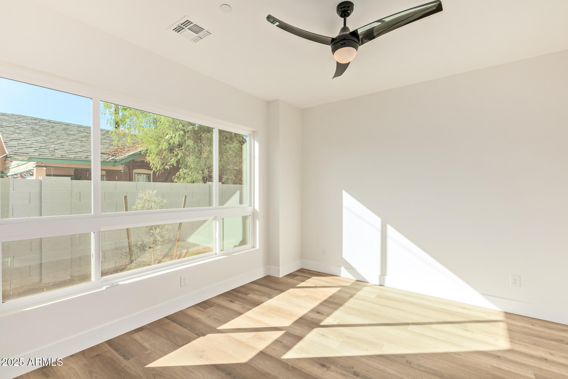 3616 North 12th Street Phoenix, AZ 85014 - Photo 9 of 25 a view of an empty room with a window