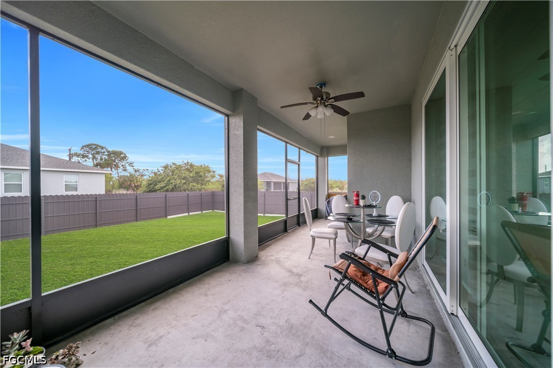384 Neighborly Road LaBelle, FL 33935 - Photo 33 of 45 a living room with a large window and a table