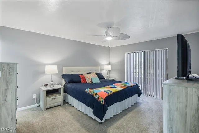 a bed room with a bed and a flat screen tv