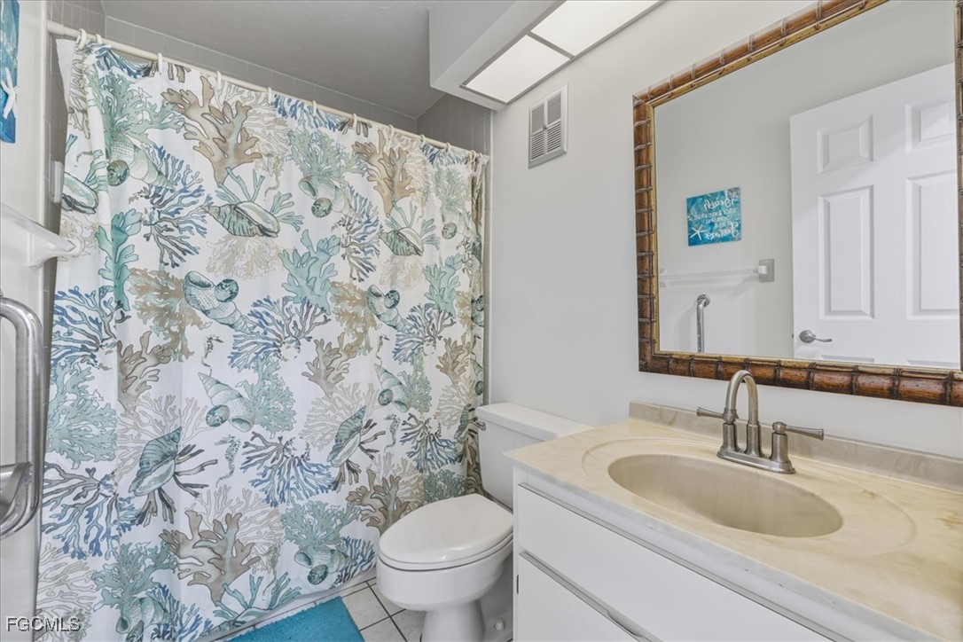 4728 Orange Grove Boulevard, Unit 8 North Fort Myers, FL 33903 - Photo 17 of 31 a bathroom with a sink and a toilet