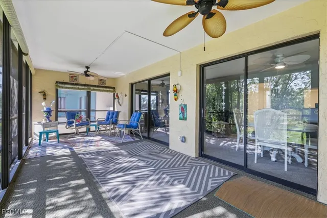 a view of a livingroom with furniture wooden floor and a rug