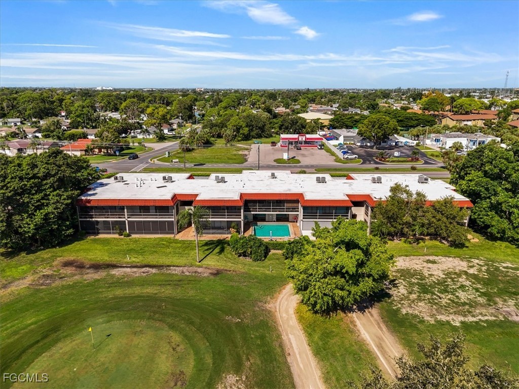 4728 Orange Grove Boulevard, Unit 8 North Fort Myers, FL 33903 - Photo 27 of 31 a view of residential houses with city view