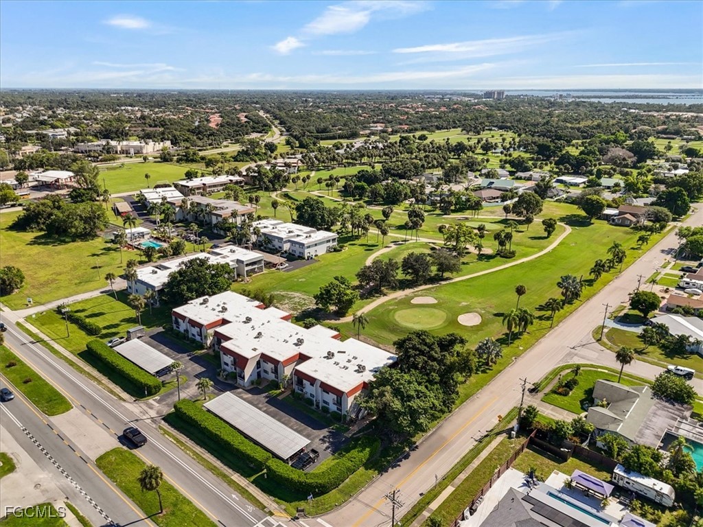 4728 Orange Grove Boulevard, Unit 8 North Fort Myers, FL 33903 - Photo 29 of 31 an aerial view of residential houses with outdoor space