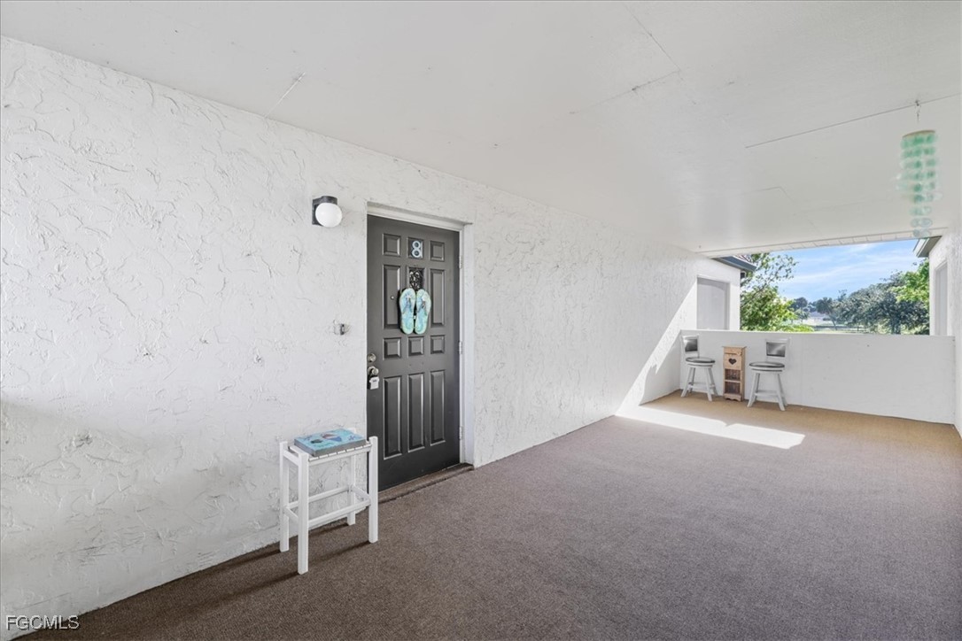 4728 Orange Grove Boulevard, Unit 8 North Fort Myers, FL 33903 - Photo 31 of 31 an empty room with windows