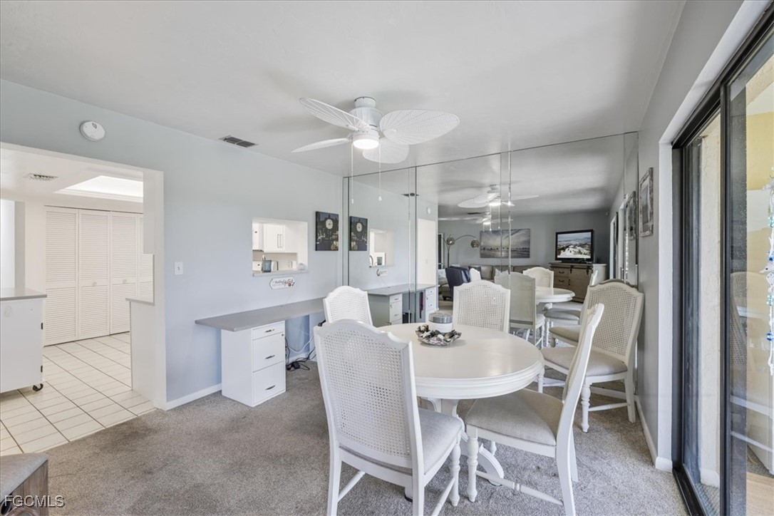 4728 Orange Grove Boulevard, Unit 8 North Fort Myers, FL 33903 - Photo 6 of 31 a view of a dining room with furniture
