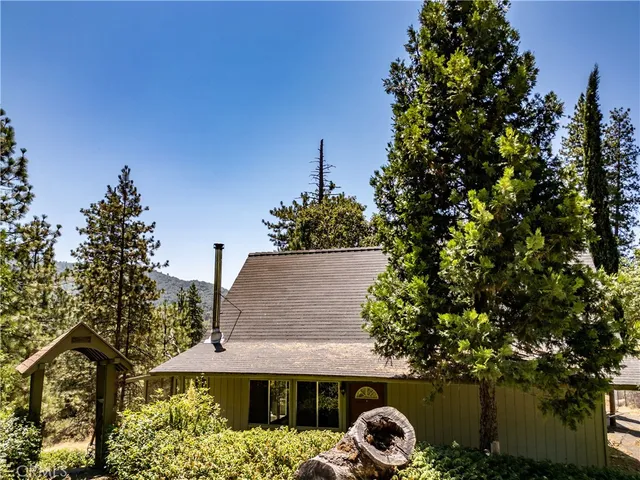 a view of a house with roof deck front of house