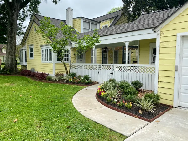 a front view of a house with garden