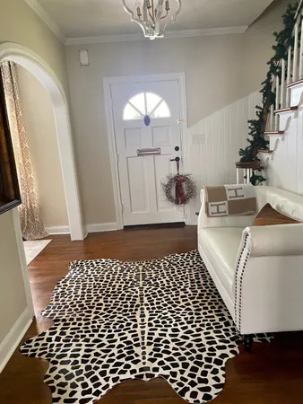 a bedroom with a bed and a mirror
