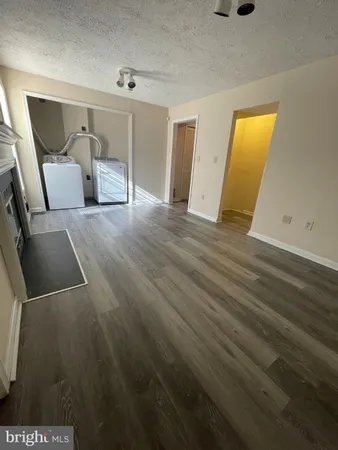 a view of livingroom with furniture and wooden floor