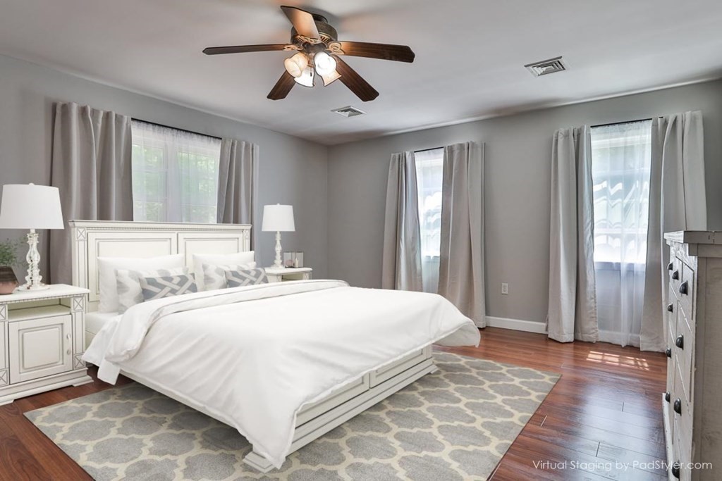 17 Highland Road Boxford, MA 01921 - Photo 19 of 42 a bedroom with a large bed and a chandelier