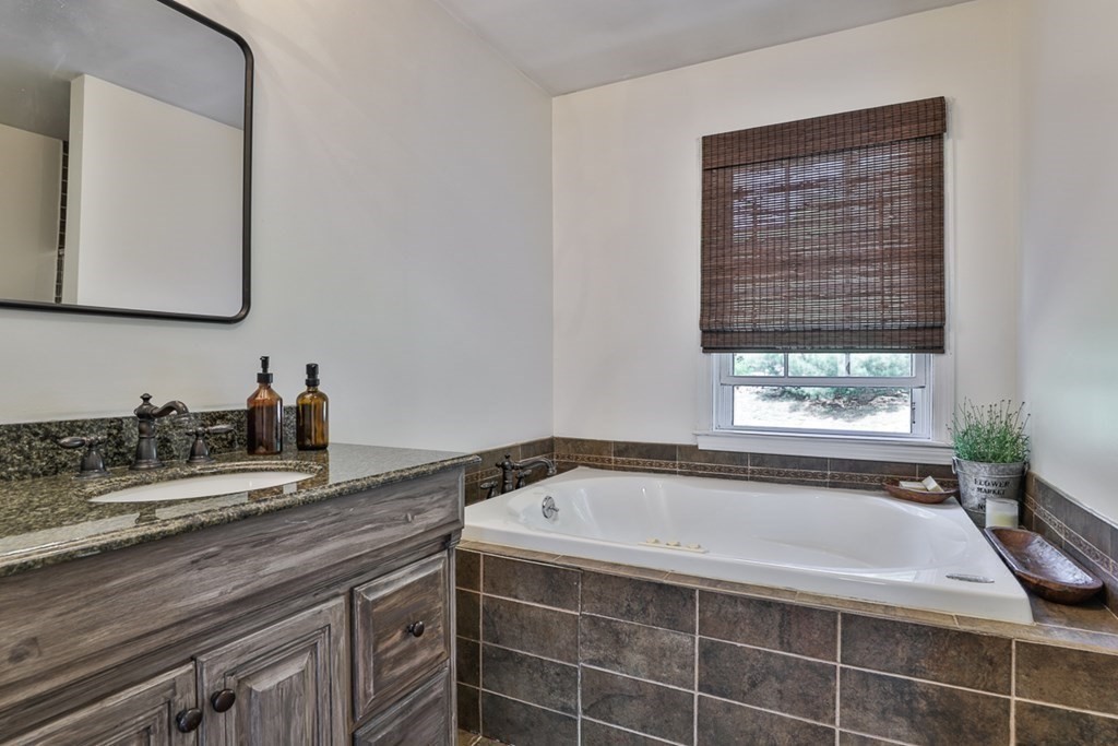 17 Highland Road Boxford, MA 01921 - Photo 22 of 42 a bathroom with a bathtub and a sink