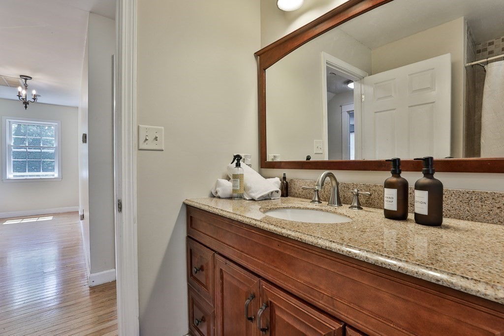 17 Highland Road Boxford, MA 01921 - Photo 27 of 42 a bathroom with a granite countertop sink and a mirror