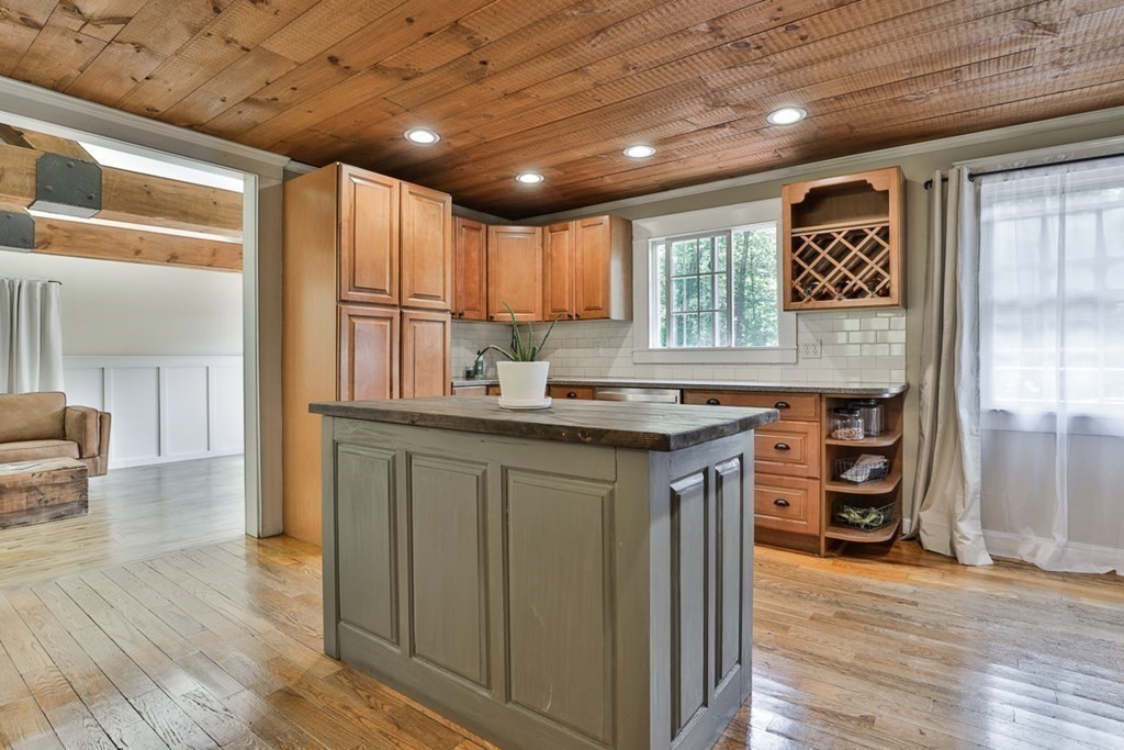 17 Highland Road Boxford, MA 01921 - Photo 3 of 42 a kitchen with granite countertop a stove cabinets and wooden floor