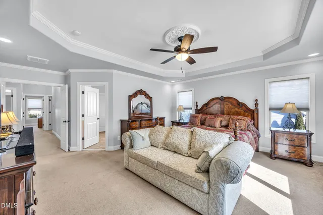 a living room with furniture a couch and a chandelier