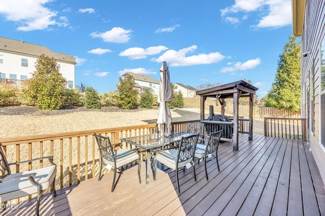 a view of a chairs and table on the wooden floor
