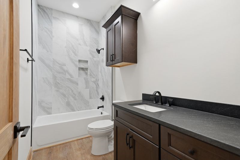 216 Old Orchard Road Ellijay, GA 30536 - Photo 2 of 59 a bathroom with a sink a toilet and bathtub