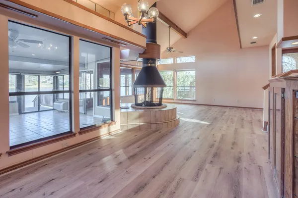 a view of a room with wooden floor staircase and windows