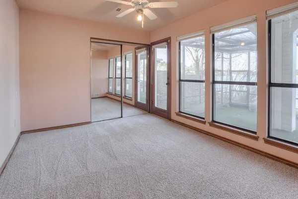 a view of an empty room with a sliding door