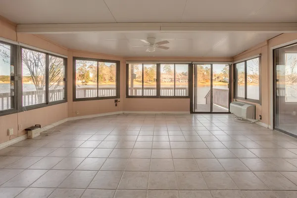 a view of an empty room with a window