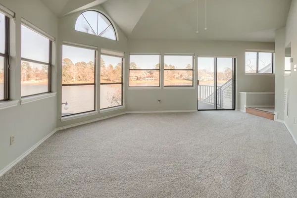 an empty room with windows and view