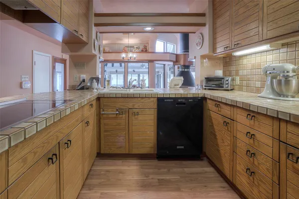a kitchen with a sink and cabinets