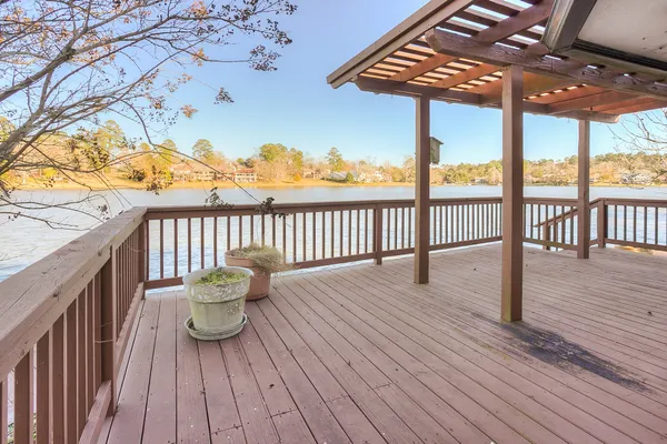 a view of a balcony with wooden floor