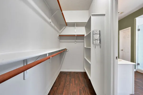 a view of entryway and hall with wooden floor