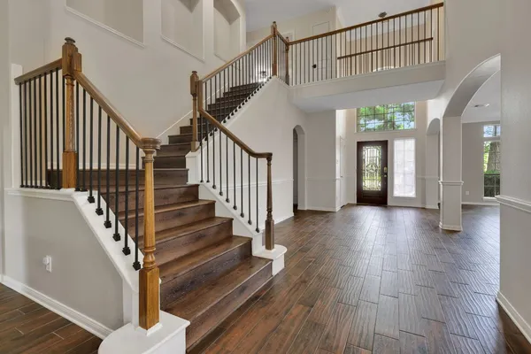 a view of entryway with wooden floor