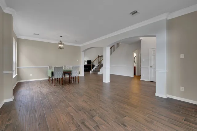 a view of a livingroom with furniture and wooden floor