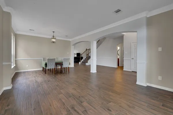 a view of a livingroom with furniture and wooden floor