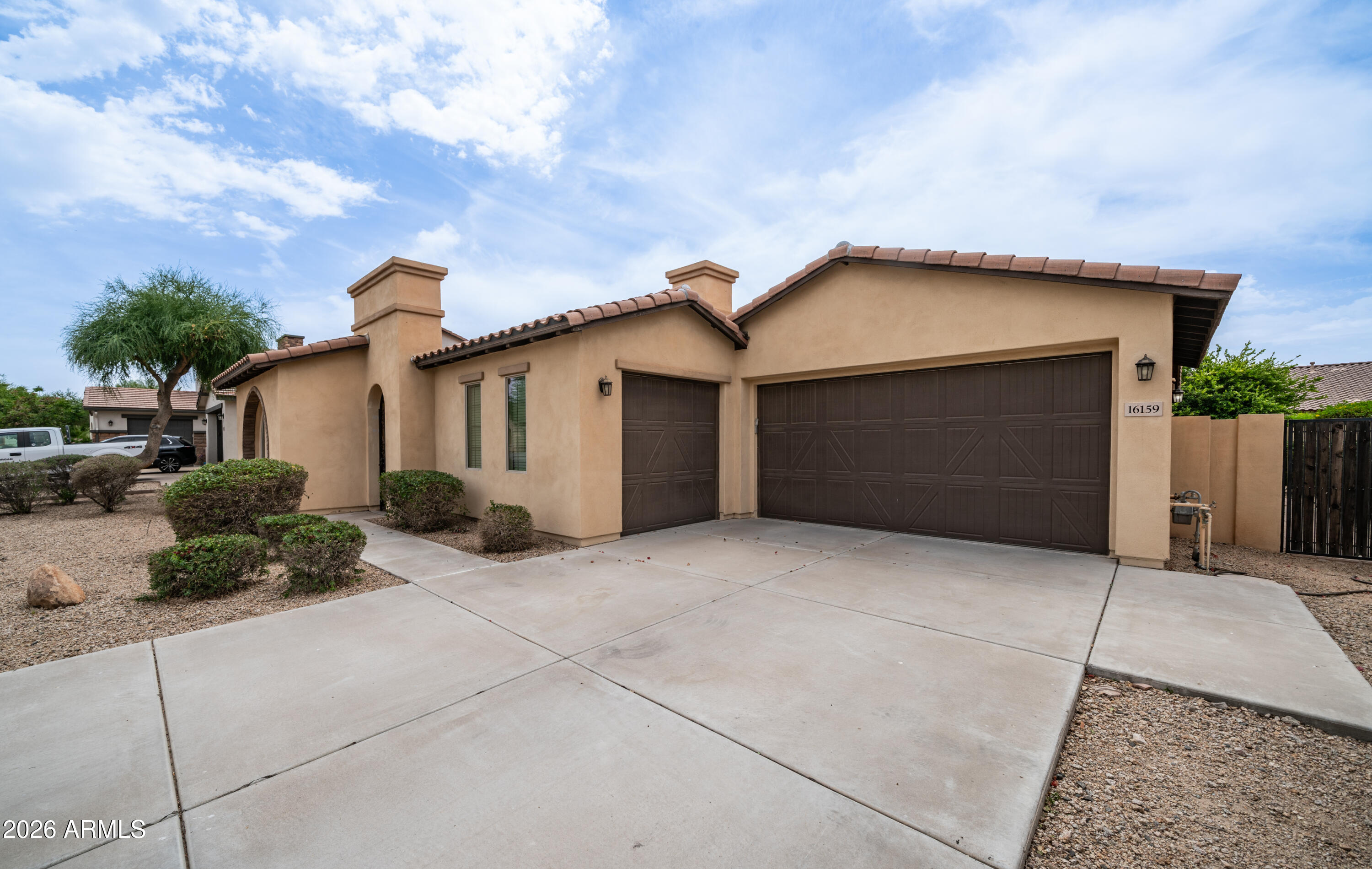 16159 West Granada Road Goodyear, AZ 85395 - Photo 1 of 41 a front view of a house with a yard and garage