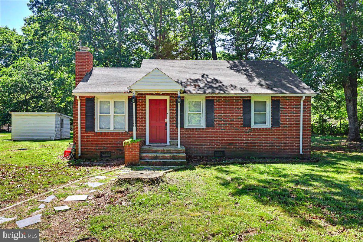 20322 Gum Tree Road Orange, VA 22960 - Photo 3 of 28 Charming brick home with lush greenery.
