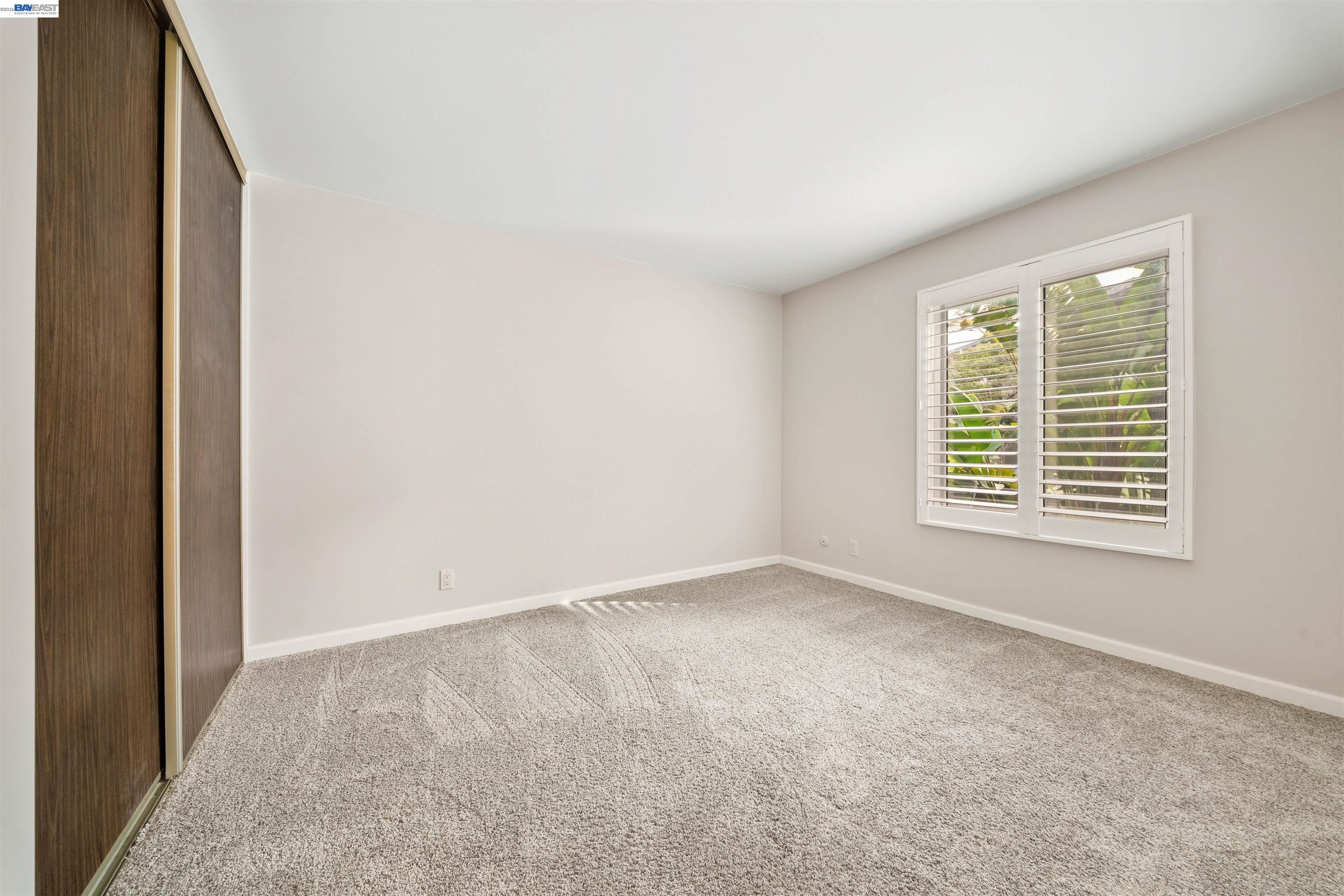 960 Shorepoint Court, Unit 116 Alameda, CA 94501 - Photo 12 of 20 a view of an empty room with a window