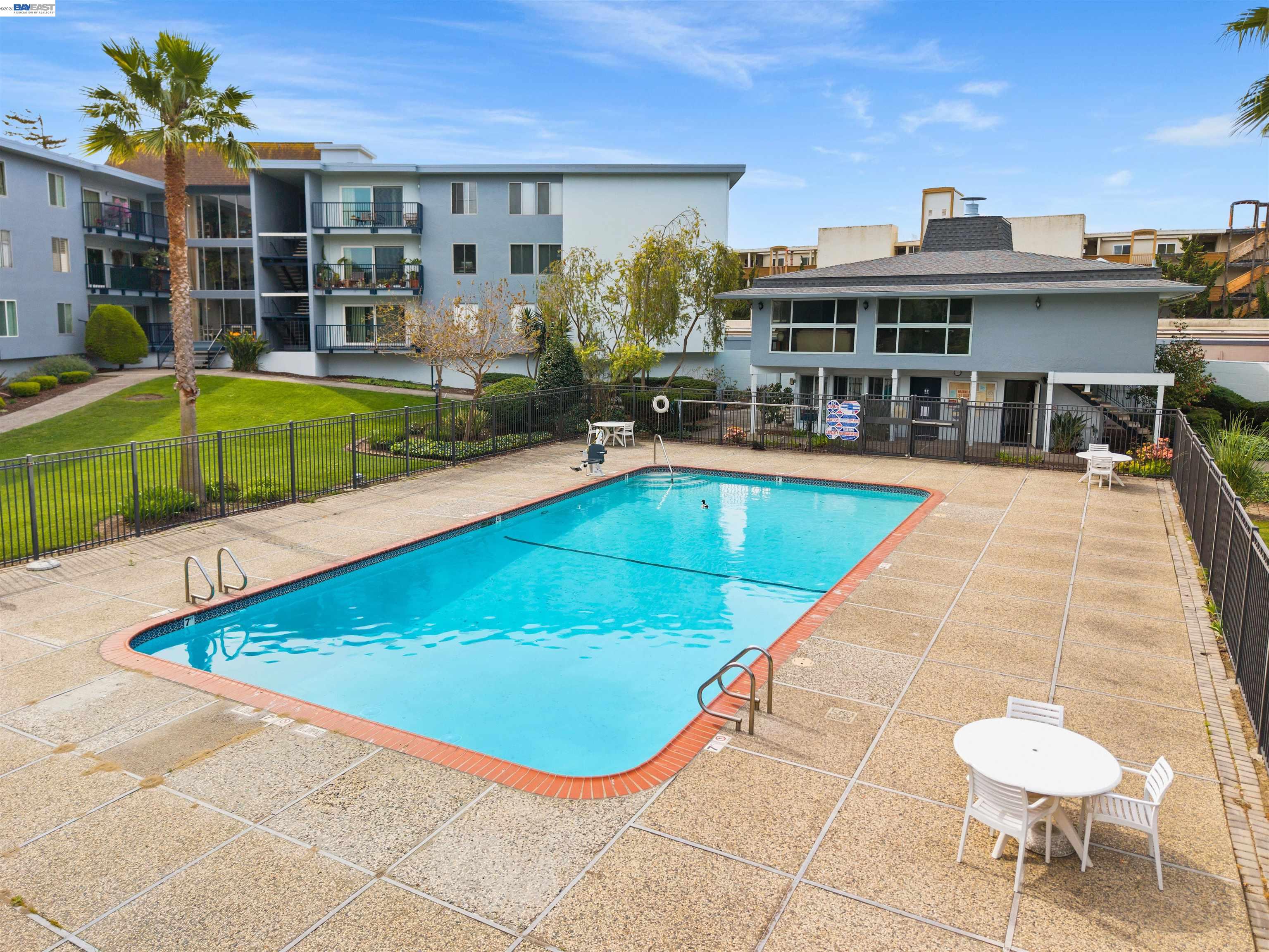 960 Shorepoint Court, Unit 116 Alameda, CA 94501 - Photo 18 of 20 a view of a swimming pool with a lounge chair