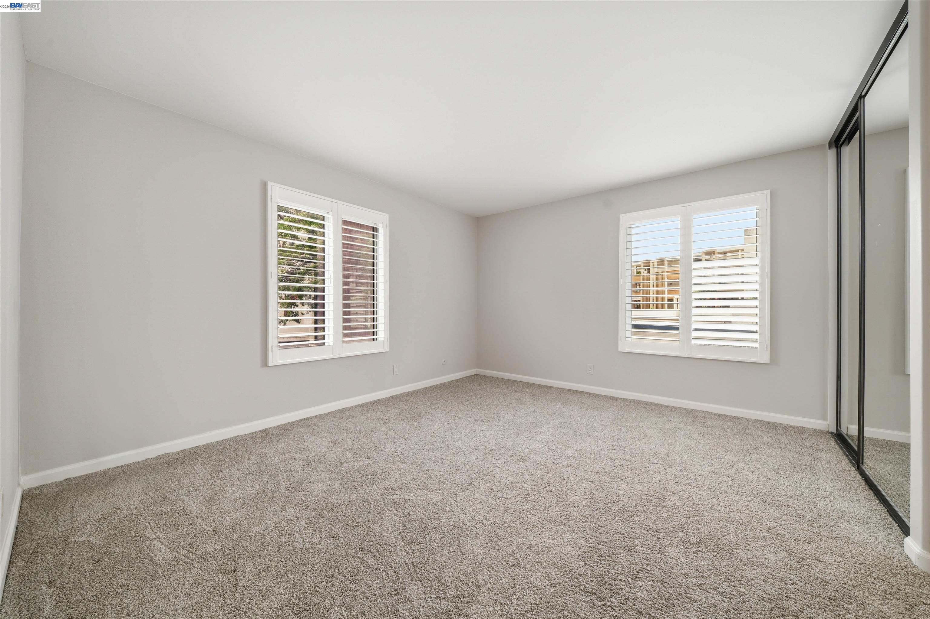 960 Shorepoint Court, Unit 116 Alameda, CA 94501 - Photo 8 of 20 an empty room with windows