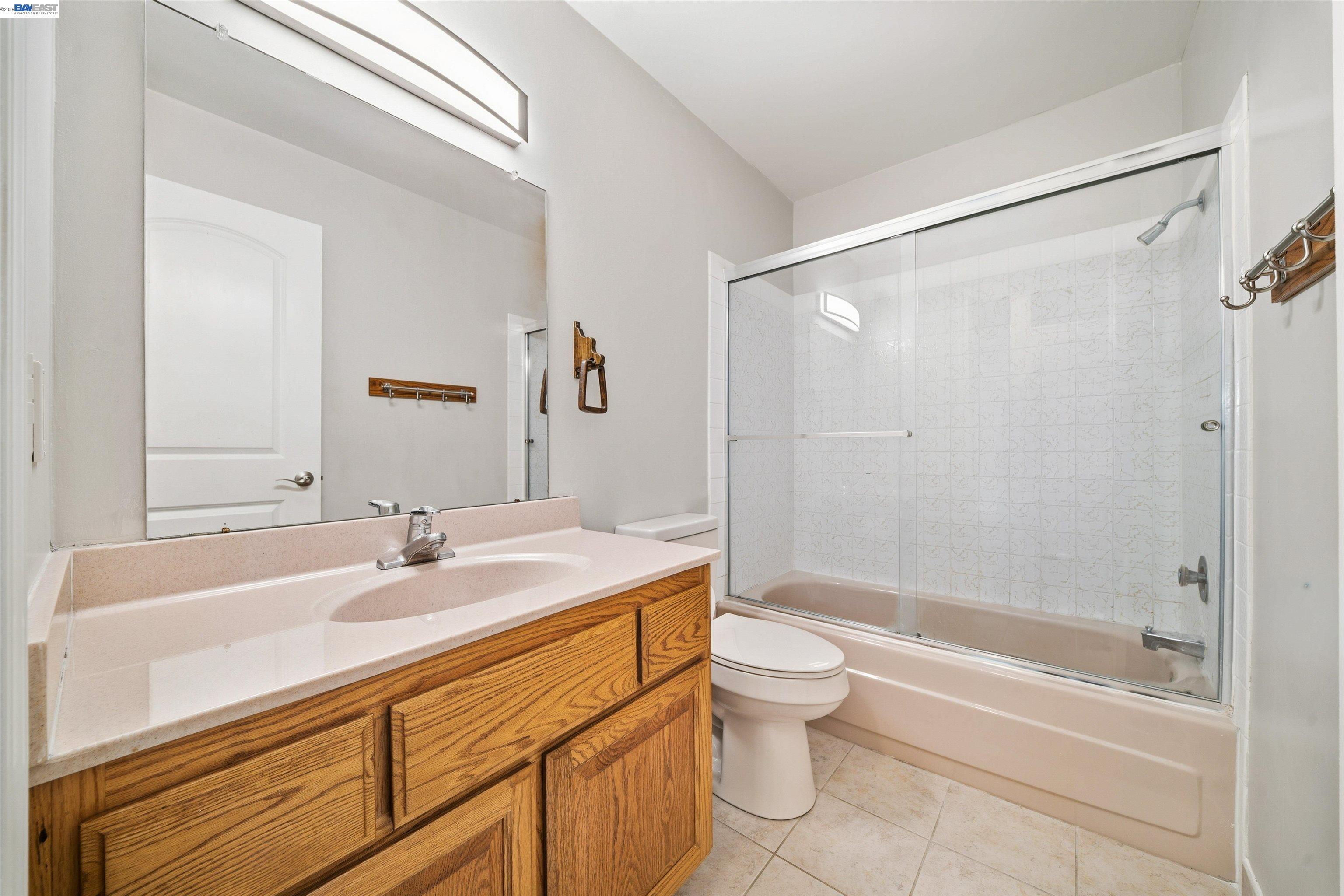 960 Shorepoint Court, Unit 116 Alameda, CA 94501 - Photo 9 of 20 a bathroom with a sink a toilet and a bathtub