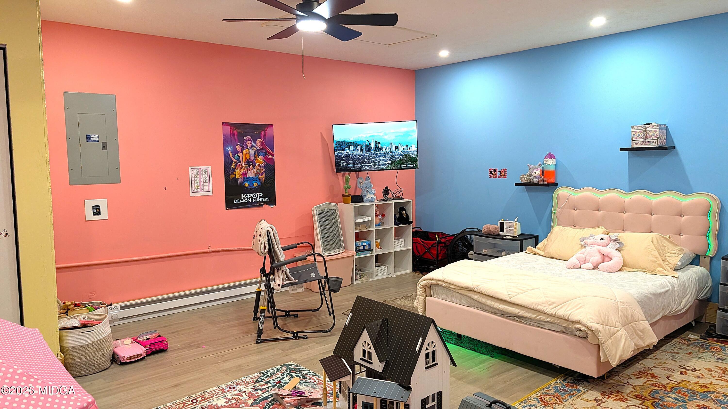 167 Apple Valley Road Macon, GA 31217 - Photo 14 of 22 a bedroom with a bed and a chandelier